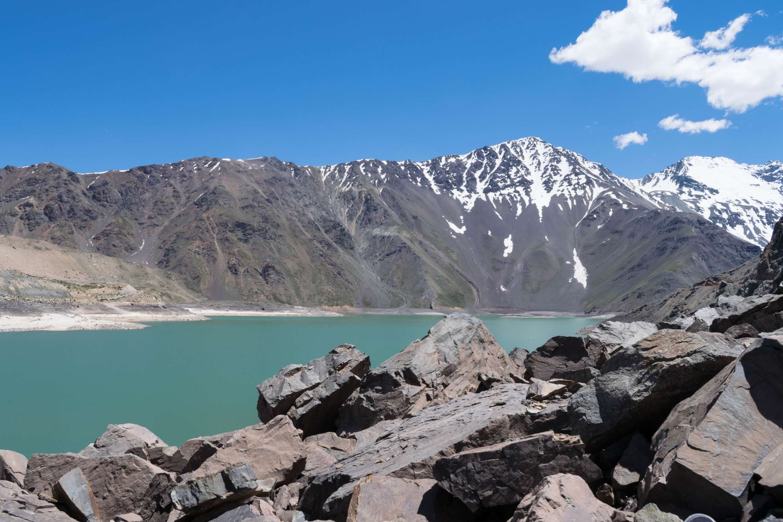 A beautiful shot of snow-covered mountains and a lake
